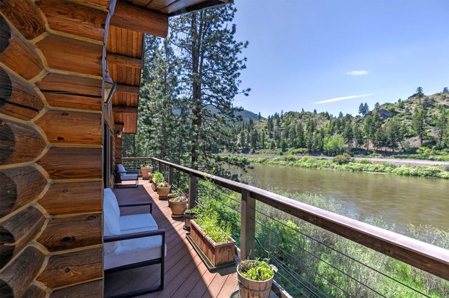 Wooden terrace with a water and mountain view | Image 40