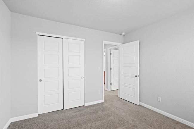 Unfurnished bedroom with carpet and a closet | Image 26