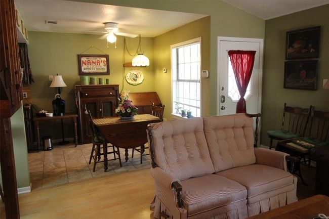 Dining room with ceiling fan and tile floors | Image 11