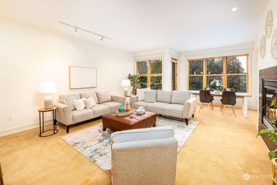 Huge and open living rooms space with 9'5 foot ceilings, thoughtful lighting and western facing windows. | Image 2