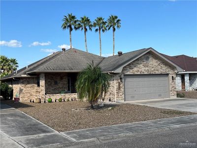 Ranch-style house with a garage | Image 1