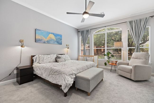 Spacious primary bedroom on main floor. | Image 20
