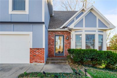 View of exterior entry featuring a garage | Image 2