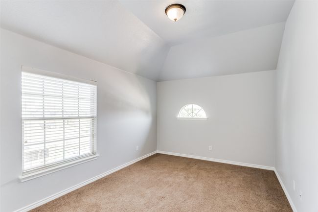 Spare room with carpet and vaulted ceiling | Image 26