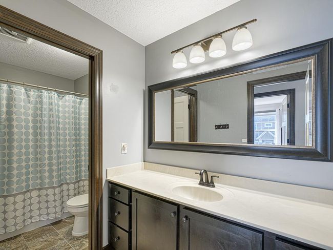 There is a shared full bathroom on the upper level to service the other three bedrooms. | Image 27