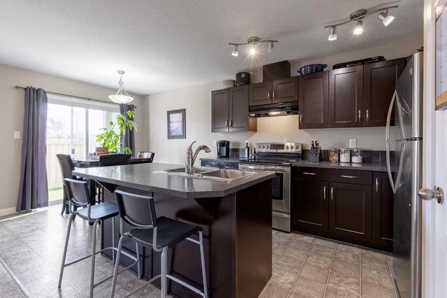8 - 205 Silkstone Rd W, Townhouse with 3 bedrooms, 2 bathrooms and 2 parking in Lethbridge AB | Image 16