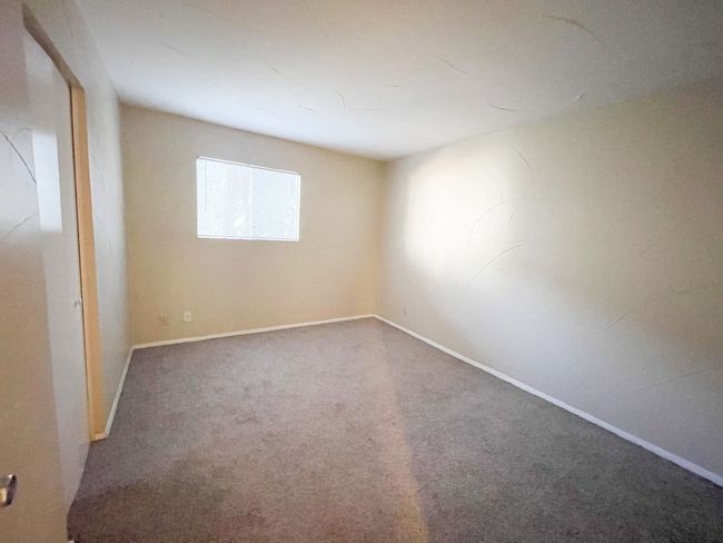 Carpeted spare room with baseboards | Image 9
