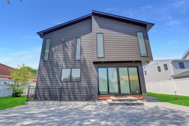 Back of property featuring a patio area and a fenced backyard | Image 33