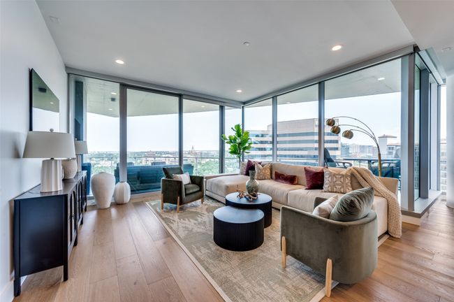 Living area featuring floor to ceiling windows, light wood-style flooring, and recessed lighting | Image 4