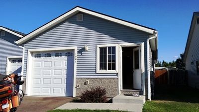 View of front facade featuring a garage | Image 1