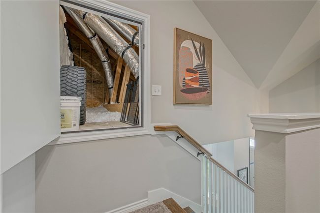 Stairway with vaulted ceiling and baseboards | Image 16