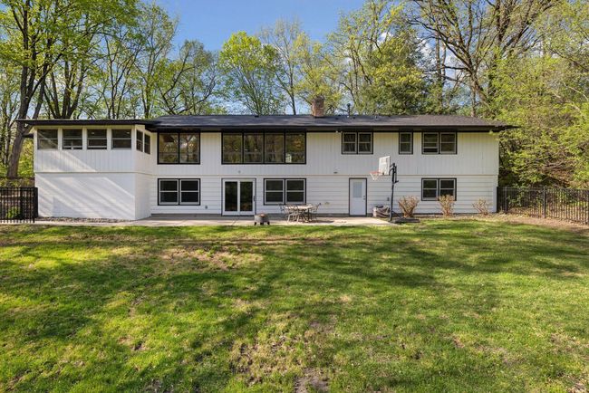 Back of home. Large grassy area to play and then surrounded by woods for privacy. | Image 36