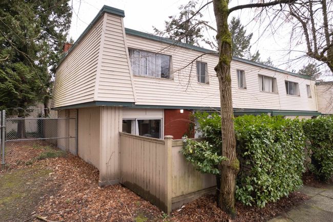 View of home's exterior featuring fence and a chimney | Image 19