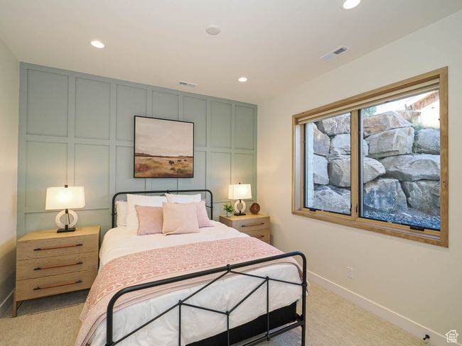 Bedroom with a decorative wall, recessed lighting, and light colored carpet | Image 79