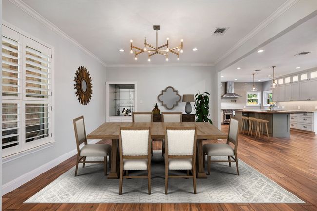 Virtually staged dining area with a small built-in buffet and a fabulous chandelier. | Image 8