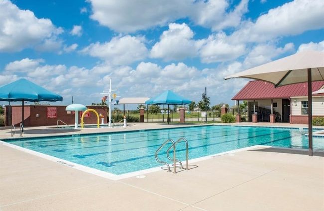 Community pool featuring a patio area | Image 29