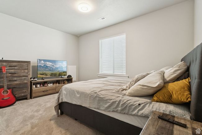View of carpeted bedroom | Image 38