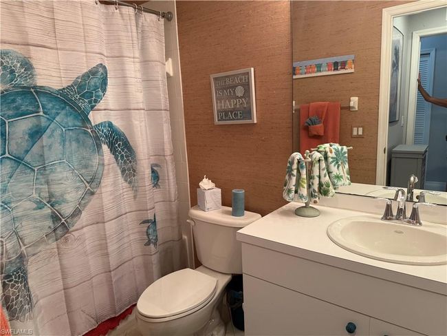Full bath featuring toilet, vanity, and a shower with curtain | Image 17