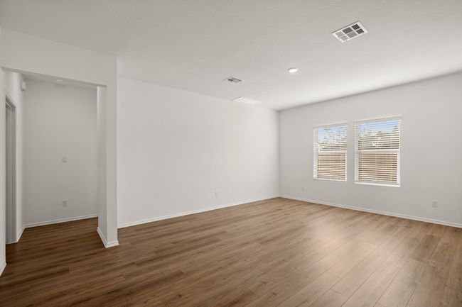 Empty room featuring visible vents, baseboards, and wood finished floors | Image 10