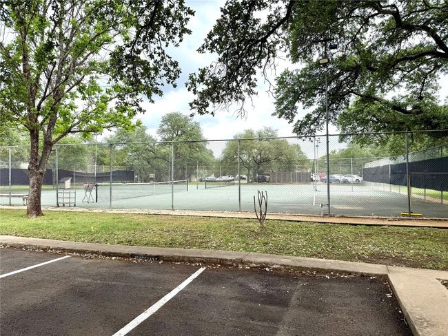 View of tennis court featuring fence | Image 22