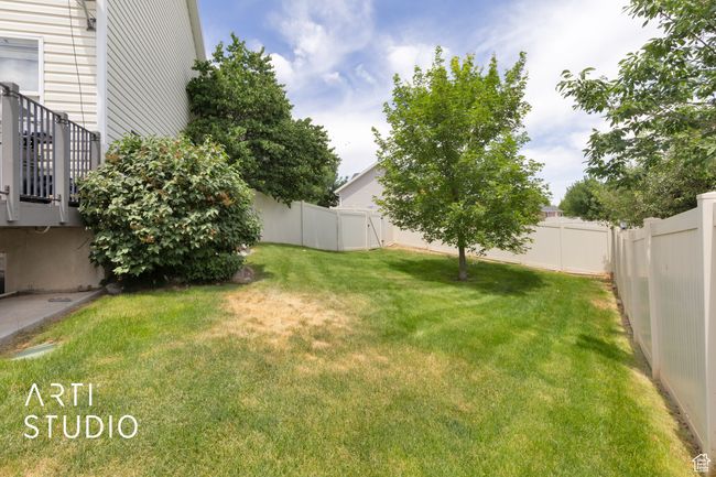 View of fenced backyard | Image 27