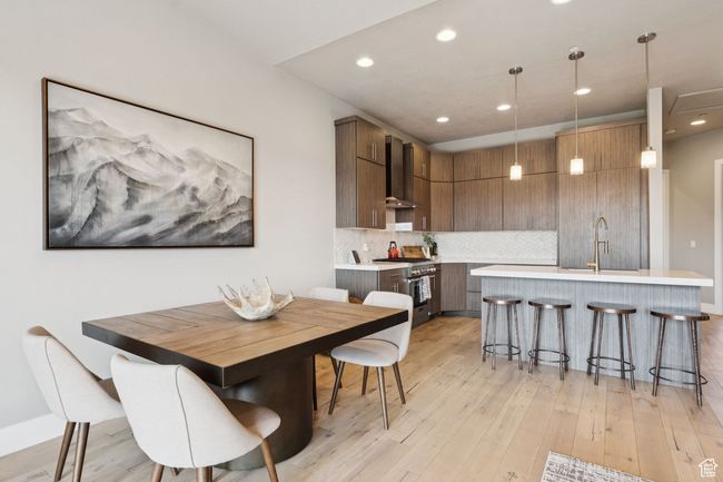 Dining area featuring light wood-type flooring and recessed lighting | Image 6