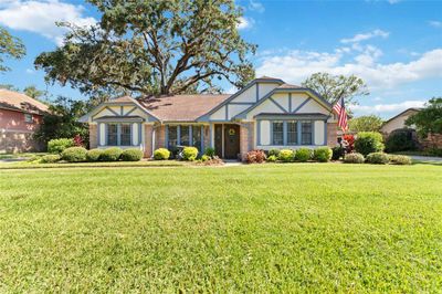 Stunning curb appeal with well manicured lawn and lush landscaping | Image 1