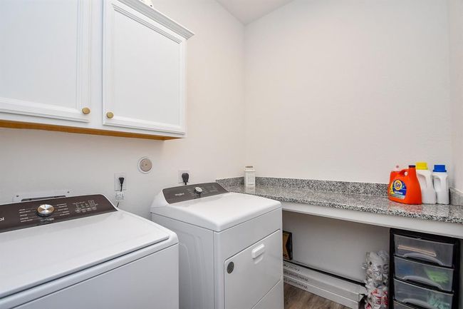 laundry room with quartz counter top | Image 30