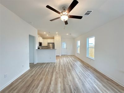 The kitchen overlooks the living room and dining area so that you never miss a beat as you prep your next meal. | Image 3