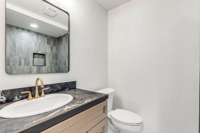 Bathroom featuring vanity and toilet | Image 22