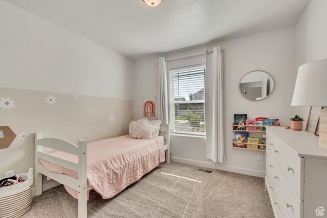 Bedroom with light colored carpet | Image 14