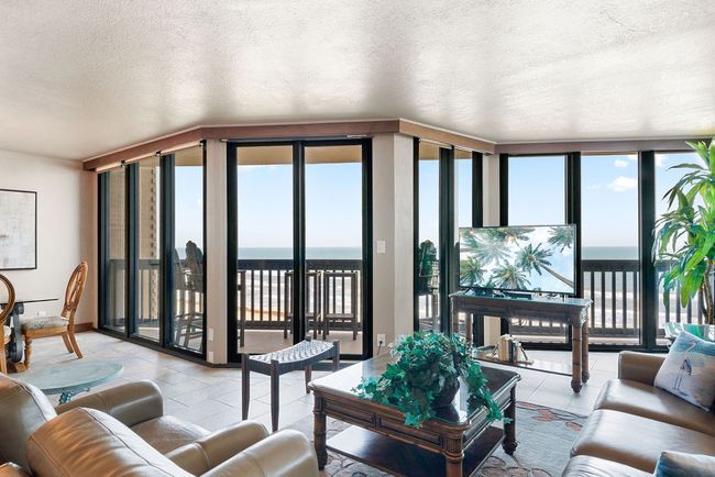 Windows and doors are impact glass. Offers beautiful views from inside the condo. | Image 4