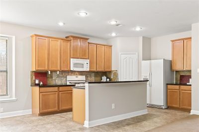 Kitchen island, walk-in pantry, white appliances | Image 3