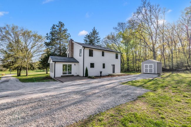 Great view of the back of the house with two patio areas. | Image 39