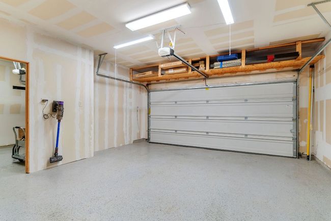Garage with a garage door opener | Image 38