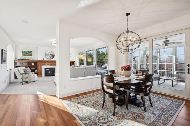 Informal Dining room with screened porch to the right. | Image 19