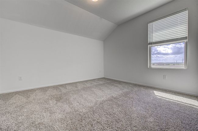 Additional living space with lofted ceiling, carpet floors, and baseboards | Image 25