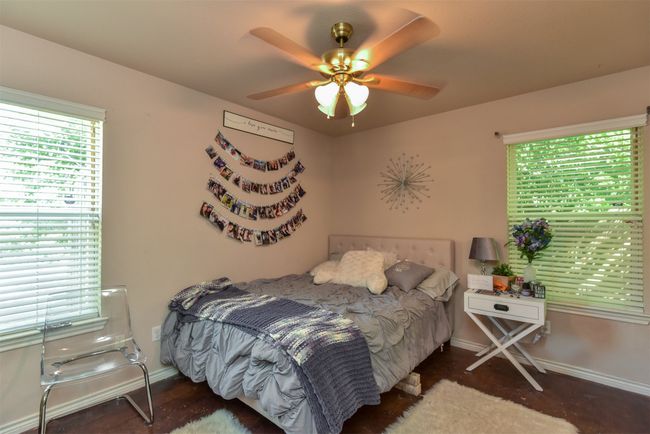 Bedroom featuring ceiling fan | Image 13