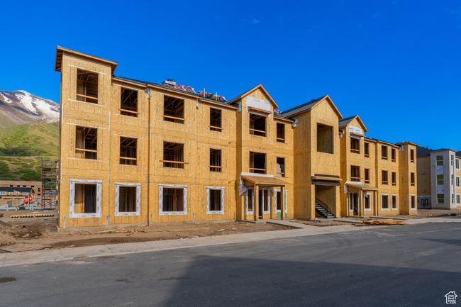 View of building exterior with a mountain view | Image 5