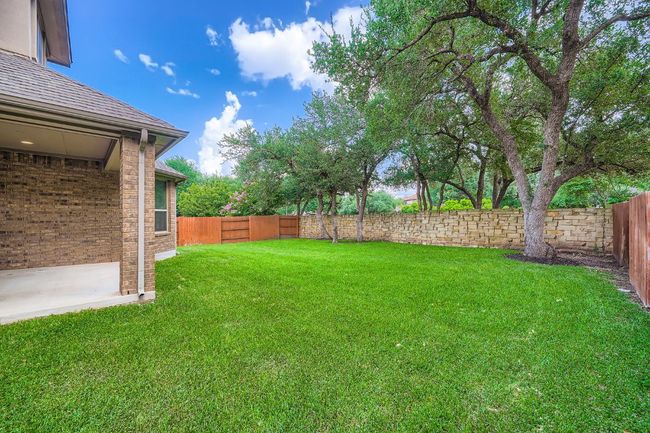 View of fenced backyard | Image 27