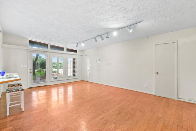 Conveniently located opposite the kitchen, a door provides direct access to both the garage and laundry room. | Image 5