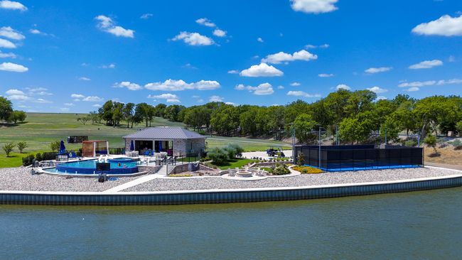 Community infinity edge heated pool, open air lounge with kitchen, pickle ball court and fire pit | Image 4
