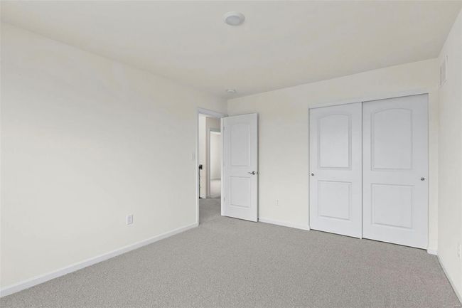 Unfurnished bedroom featuring carpet flooring and a closet | Image 14