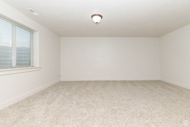 Spare room featuring carpet flooring and baseboards | Image 22