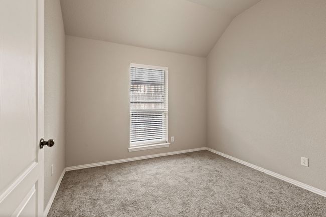 Carpeted empty room with vaulted ceiling and baseboards | Image 24