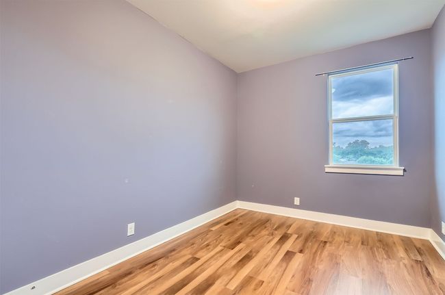 Empty room featuring light wood-style floors and baseboards | Image 17