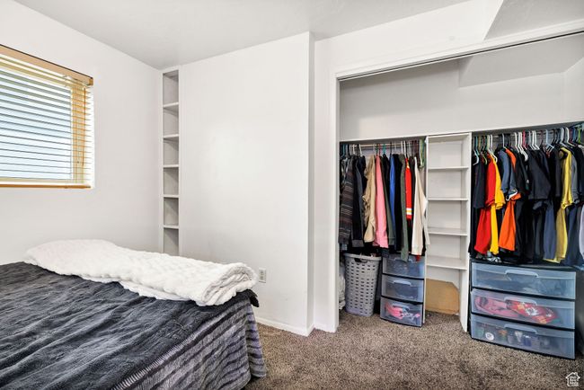 Bedroom featuring carpet flooring, a closet, and baseboards | Image 26