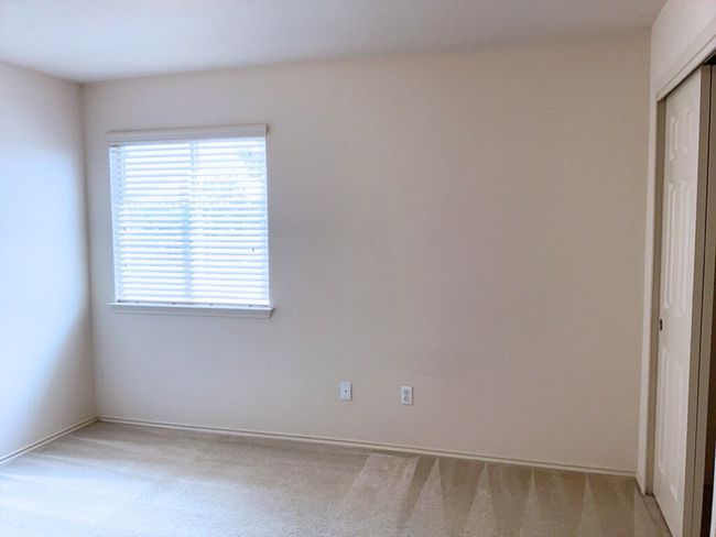 Bedroom featuring light carpet and baseboards | Image 19