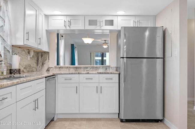 Updated kitchen with granite countertops and continued backsplash | Image 13