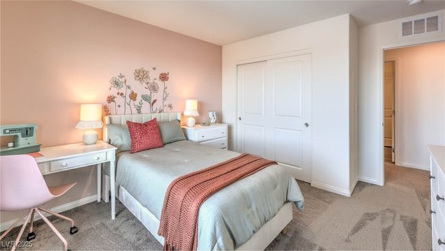 Photo is representational only; actual home finishes may vary. Bedroom featuring light colored carpet, a closet, and baseboards | Image 13